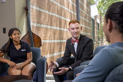 Students sitting with advisor