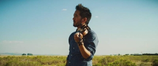 photo of man with violin, with open sky background