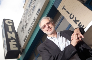 photo of man, marquee in background