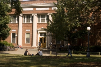 photo of building facade, people in foreground, day