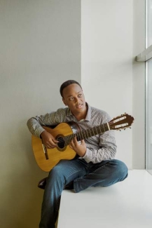 photo of man with guitar