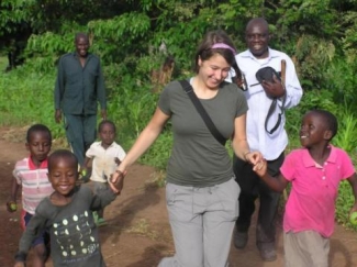 photo of children with woman and two men on path