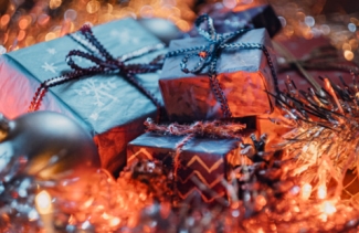 christmas presents surrounded by lights and garland