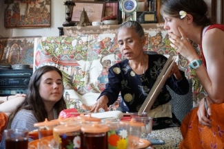 photo with three women with tea and portfolio