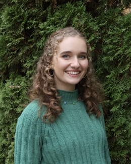 photo of woman, green foliage in background