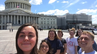 photo of eight students with US capitol building