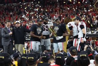 photo of stadium trophy ceremony, confetti, players