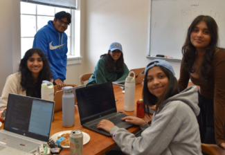 photo of five people with laptop computers