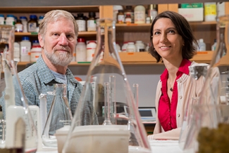 photo of man and woman in lab, with beakers