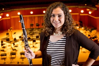 woman in balcony with clarinet