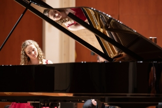 photo of woman playing piano