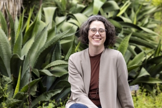 photo of woman with garden in background, day 