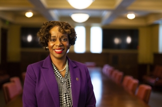 photo of woman in board room