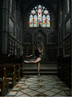 photo of woman in dance pose in chapel 