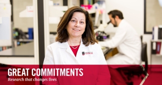 photo of woman with color graphic and man with microscope in background