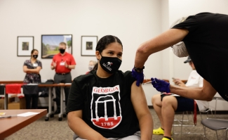 photo of woman getting vaccinated