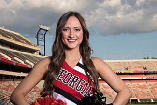 cheerleader in uniform with stadium