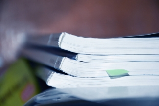 photo of small stack of bound manuscripts