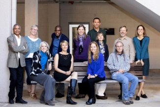 group photo of people outside daytime, four sitting, eight standing