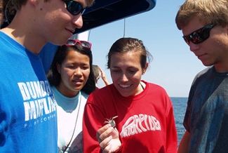 students on a boat, water