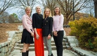 photo of four women on walkway, day