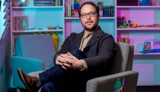 photo of man seated in office