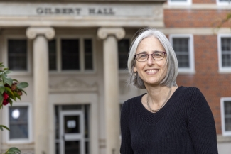 photo of woman, building in background