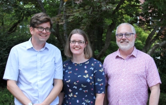 photo of three people, outdoors