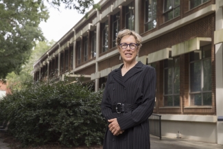 photo of woman outside of building, day