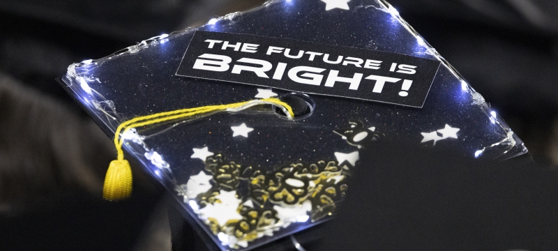 photo of mortarboard with writing on top