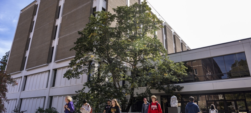 photo of building with students, day