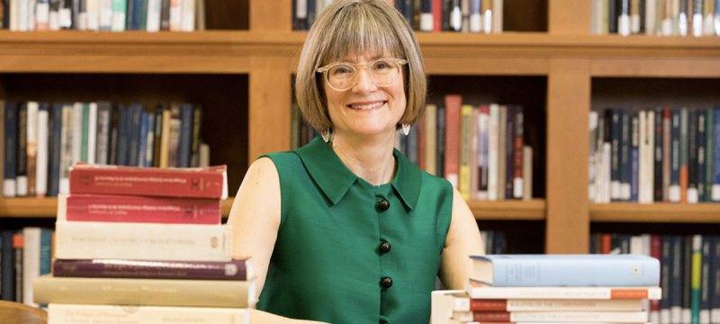 photo of woman with books