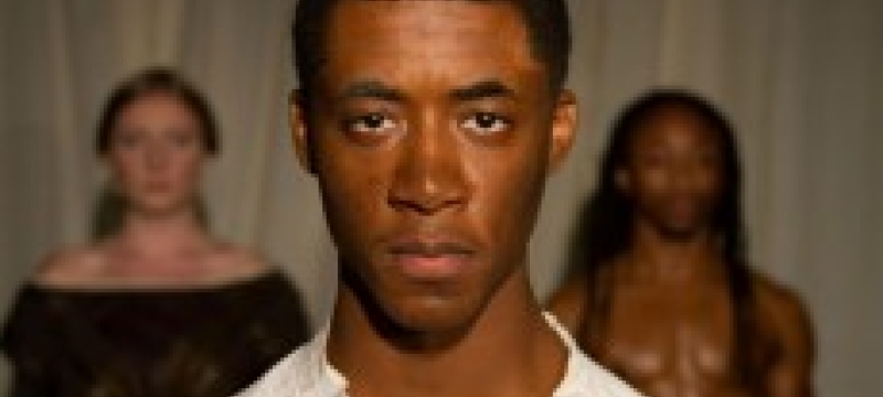 african american man, with two people in the background