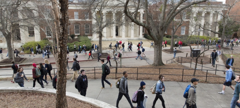 photo of building with students in the foreground 
