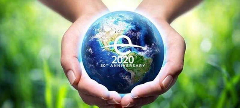 photo graphic of globe model in two hands