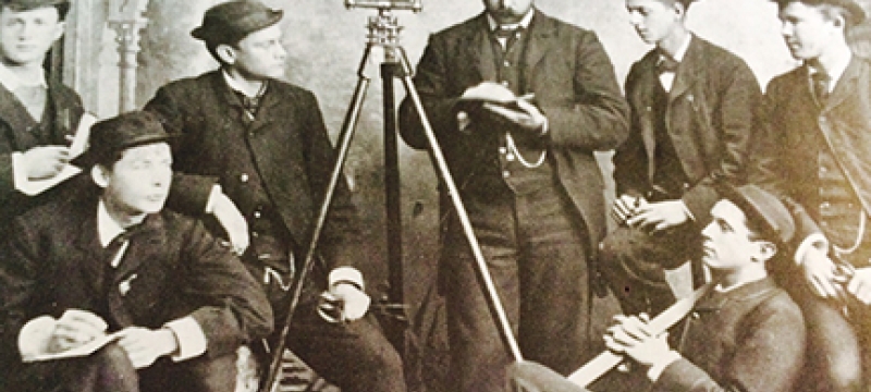 historical black and white photo of men with instruments
