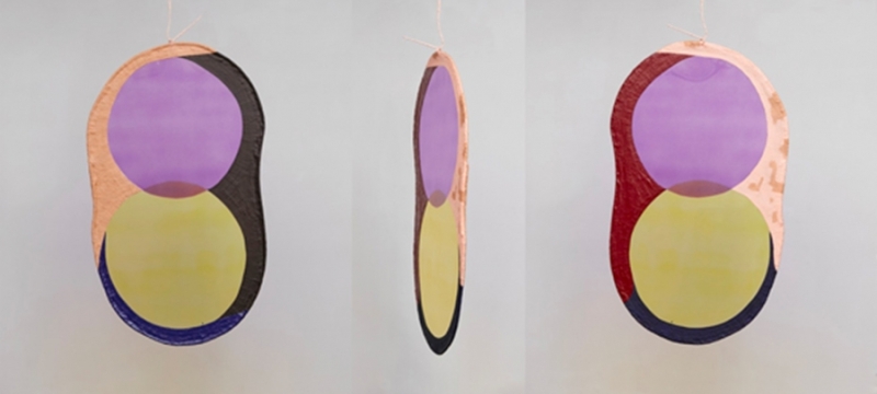 photo of three colorful mobiles with circles, hanging