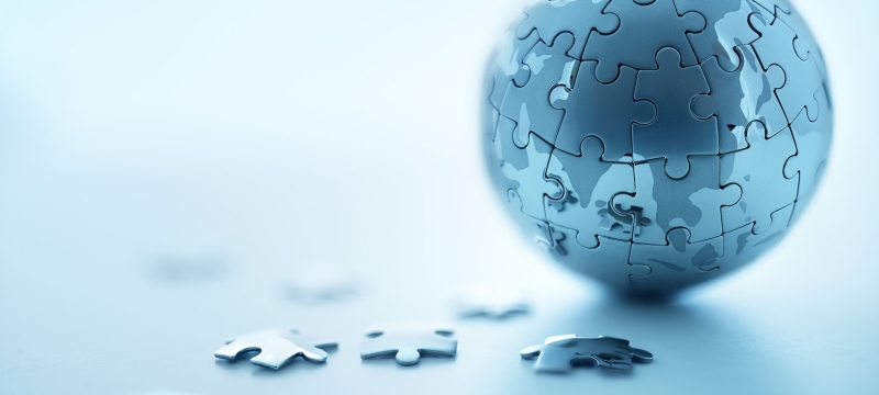 photo of globe made from small puzzle pieces