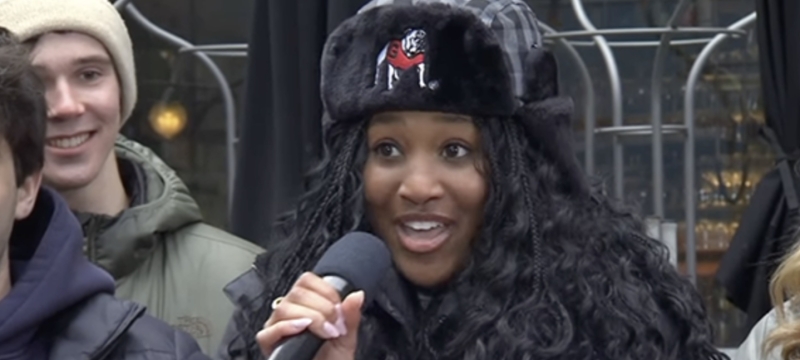 photo of woman with winter hat and microphone