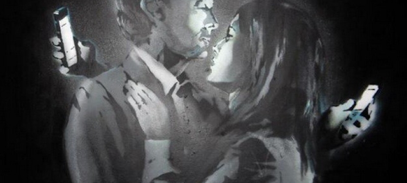 photo of graffiti drawing of couple looking at smartphones