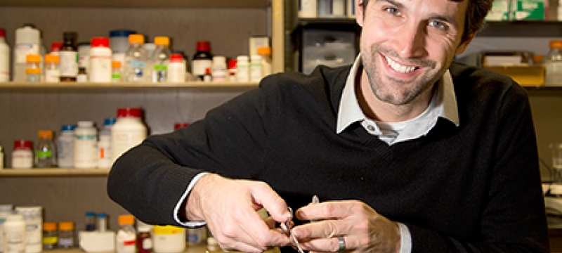 man in lab with plants
