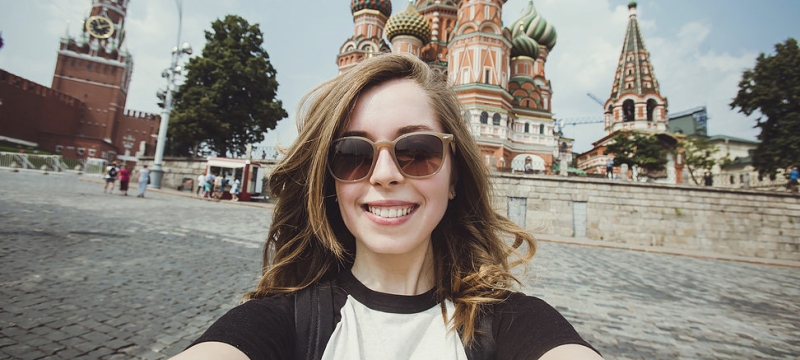 selfie photo of woman with orthodox cathedral in background