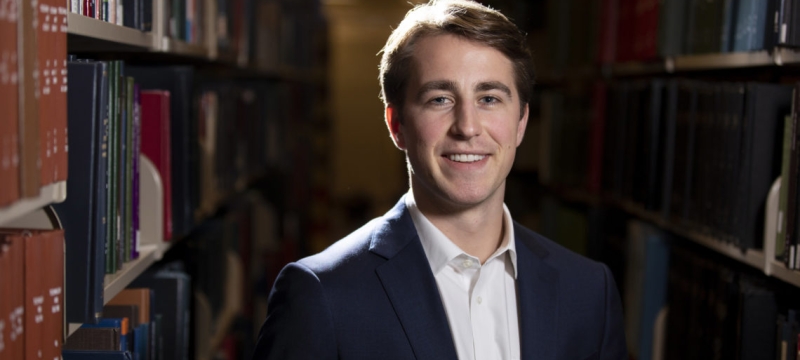 photo of man in library