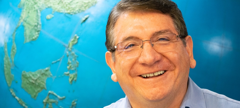 photo of man with globe background