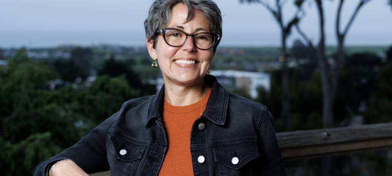 photo of woman, distance in background, day