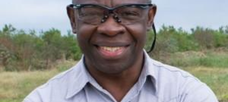 headshot photo of a man outdoors
