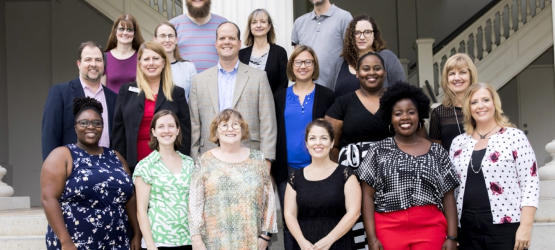 group photo on steps of the Hunter Holmes academic building
