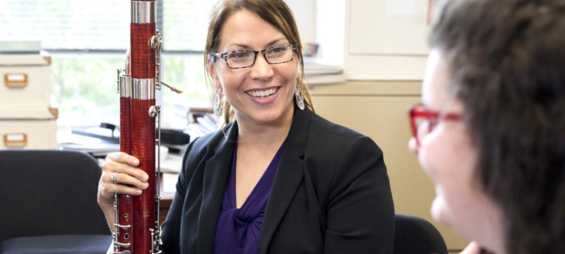 photo of woman with bassoon, and student