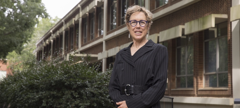 photo of woman outside of building, day