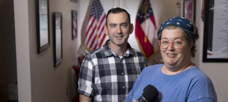 image of man and woman, woman holding a microphone